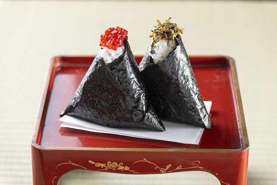 Nori is an essential ingrediant when you are making onigiri. Left onigiri with salmon roe topping. Right onigiri with takana leaf pickles
