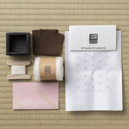DIY Sashiko Pin Cushion Kit and its contents in the box including step by step instructions