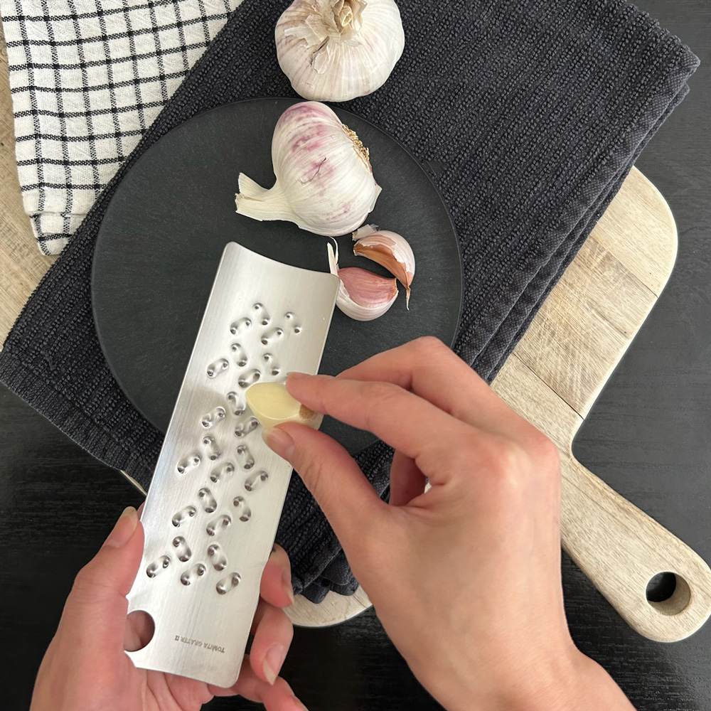 Tomita garlic and ginger grater styled with garlic