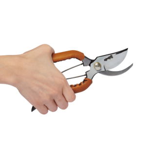 Hand holding the new Trendy Small Leather Handle in Camel Colour Open crafted by Toyama Hamono